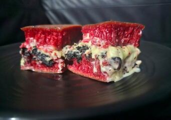 ice cream dessert Martabak manis red velvet with black cookies and cheese filling.Sweet Indonesian pancake filled with black cookies and cheese.Sweet red velvet martabak,Terang bulan 