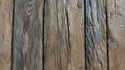 Wooden planks lay side by side on a surface showing the natural patterns and textures. The colors vary from light to dark emphasizing the grain structure.