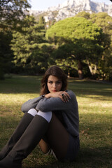  beautiful young slavic woman with long dark natural hair in elegant clothes