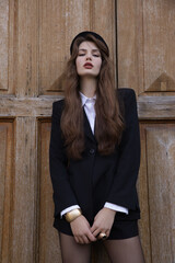  beautiful young slavic woman with long dark natural hair in elegant clothes