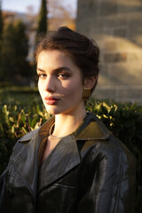  beautiful young slavic woman with long dark natural hair in elegant clothes