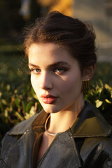  beautiful young slavic woman with long dark natural hair in elegant clothes