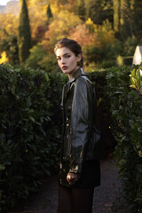  beautiful young slavic woman with long dark natural hair in elegant clothes