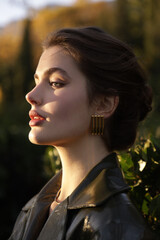  beautiful young slavic woman with long dark natural hair in elegant clothes