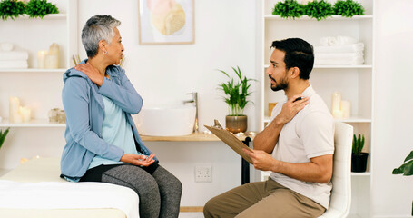 Consultation, physical therapist and mature woman with injury on shoulder, wellness or health....