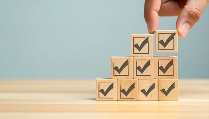 Hand Completing Grid of Checkmark Wooden Blocks  Quality Control, Compliance, and Standard Verification