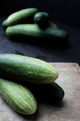cucumbers on a wooden background