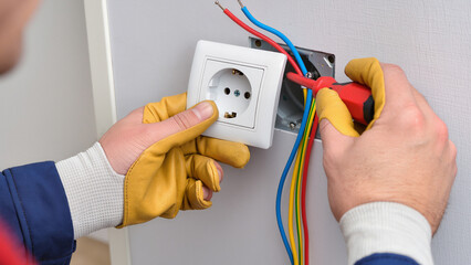 electrician with electric plug