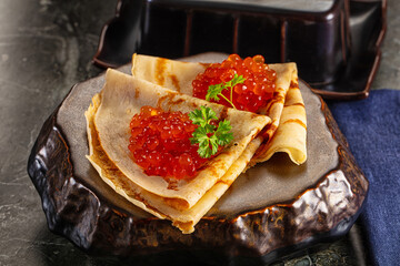 Russain traditional pancakes with red caviar