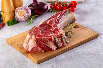 Raw prime beef steak with bone