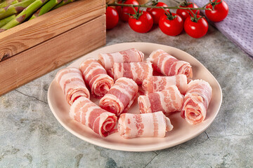 Raw bacon pork roll sliced