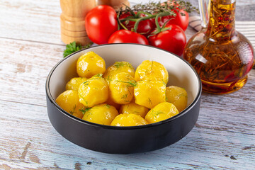 Boiled young potato with oil