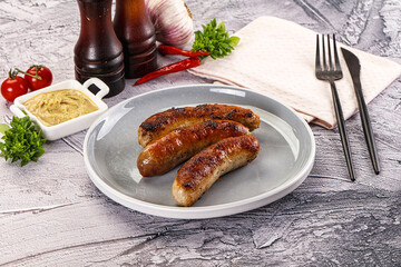 Delicous natural roasted sausages in the plate