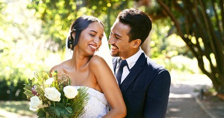 Wedding, couple and smile with flowers at park for marriage ceremony, loyalty and love commitment. Happy people, bride and groom with celebration at reception for relationship union, bonding or bokeh
