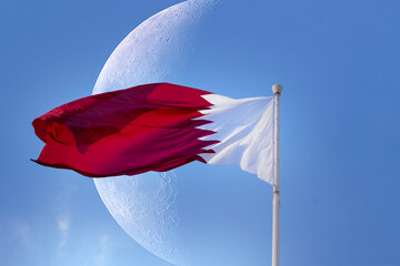 Doha, Qatar- December 10, 2025: Qatar Flag flying high in the wind. National Museum Qatar 