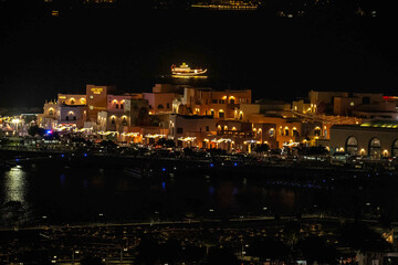 Doha, Qatar - December 10, 2025: Night view of Old Doha port redevelopment into Mina district Box Park Qatar