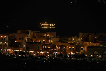 Doha, Qatar - December 10, 2025: Night view of Old Doha port redevelopment into Mina district Box Park Qatar
