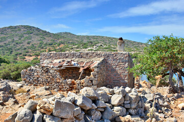 Ruined old house near Elounda town on the island of Crete in Greece