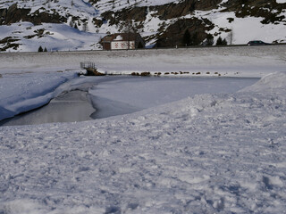 Obraz premium Simplon Pass, Switzerland in the winter. Frozen lakes.