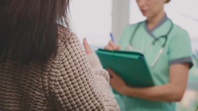 female doctor listening to complaints writing medical case report diagnosis, prescription for senior woman patient in office clinic, health records for treatment. healthcare worker talking to elderly