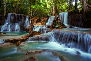 Obraz premium Multi Tier Tropical Waterfall with Clear Blue Pools in Forest