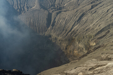 Dramatic view into a volcanic crater showcasing the raw power and geological formations below