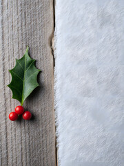 Holly Berries and Leaves on Rustic Wood: Festive Christmas Decoration with Red & Green Nature