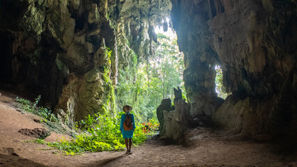 Venture into the stunning caves of Khao Sok Thailand, surrounded by lush greenery and unique rock...