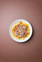 Pasta with bolognese sauce and cheese. Italian cuisine. Traditional recipe.