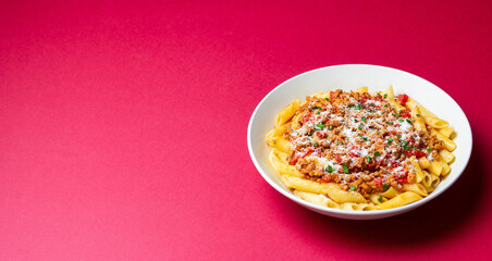 Pasta with bolognese sauce and cheese. Italian cuisine. Traditional recipe.