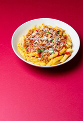 Pasta with bolognese sauce and cheese. Italian cuisine. Traditional recipe.