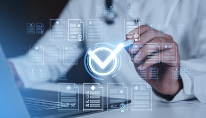 Doctor using digital interface with medical documents and check mark hologram on futuristic blue background, symbolizing healthcare approval concept.