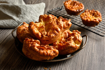 Yorkshire puddings on plate on wooden table