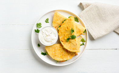 Chicken avocado quesadillas served with sauce