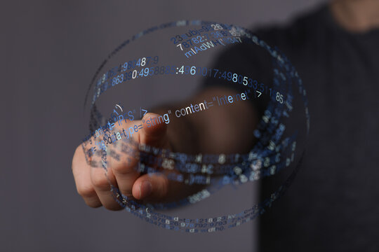 A hand interacting with a digital data sphere, symbolizing technology, innovation, and futuristic concepts. Represents internet, codi