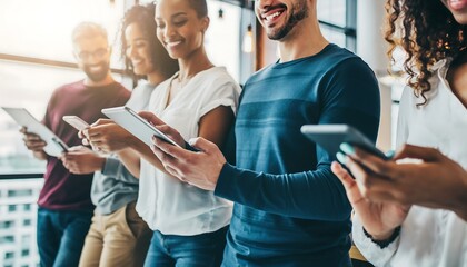 Group of diverse multiethnic people using smartphones and digital tablets in modern office, technology connectivity concept
