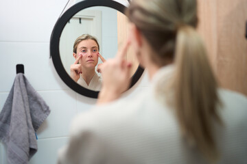 Focused Skincare Moment in Front of the Mirror