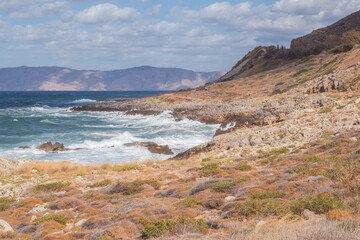 Cretan seascape in windy weather with strong surf and white foam on the sea