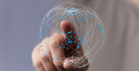 Hand touching a digital network sphere, representing global connection, technology, and communication, ideal for business and futuris