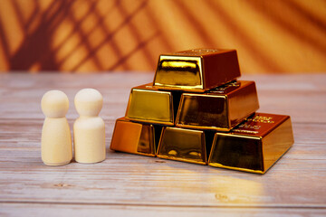 Wealth accumulation and financial partnership concept showing people beside gold assets, symbolizing shared prosperity, investment growth, savings protection, and long term financial stability.