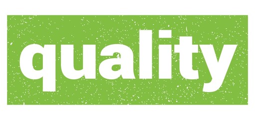 quality text written on green stamp sign.