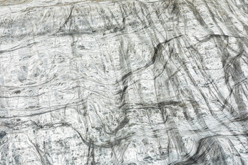 Abstract marble texture with veined gray stone swirls for background design and artful projects creatively