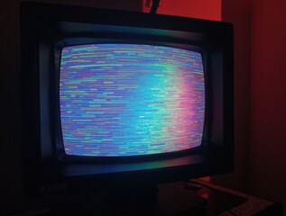 Vintage CRT television screen showing colorful glitch static