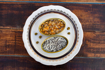 Cans of preserves with elvers and cockles