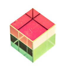 a transparent, three-dimensional cube with a rainbow gradient. The cube has a glass-like texture with subtle reflections and refractions, giving it a semi-reflective appearance