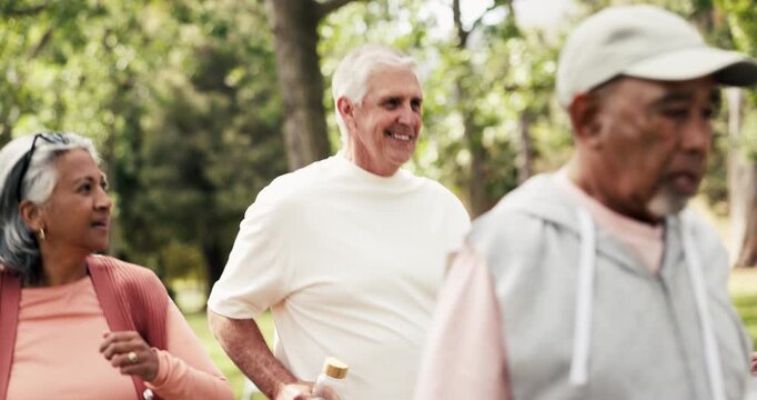 Fitness, old people and power walk with friends in nature for health, wellness or talk to coach. Smile, group and exercise class at park for low impact cardio, workout or retirement with instructor