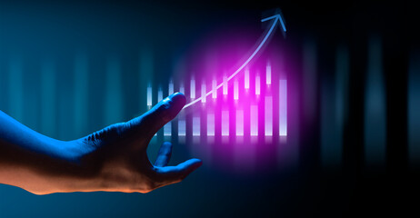 hand of businessman interactive touching a holographic financial growth graph chart system network...