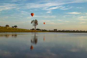 hot air balloon over dam