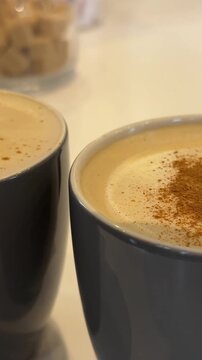 cinnamon spice for your milk coffee benefits of cinnamon Thursday traditions gray coffee cups decorating chocolate sprinkles cafe