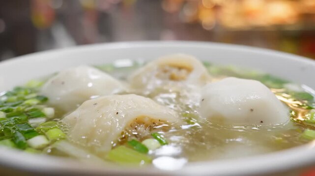 Close Up of Fish Balls With Green Onions in Soup, Steaming, Macro